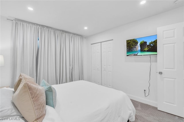 bedroom with carpet and a closet