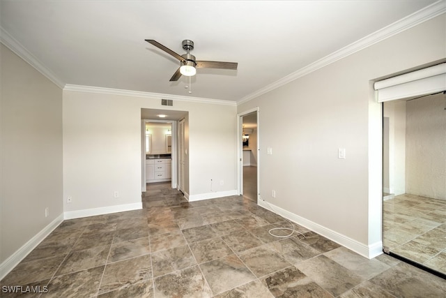 unfurnished bedroom featuring ceiling fan and crown molding