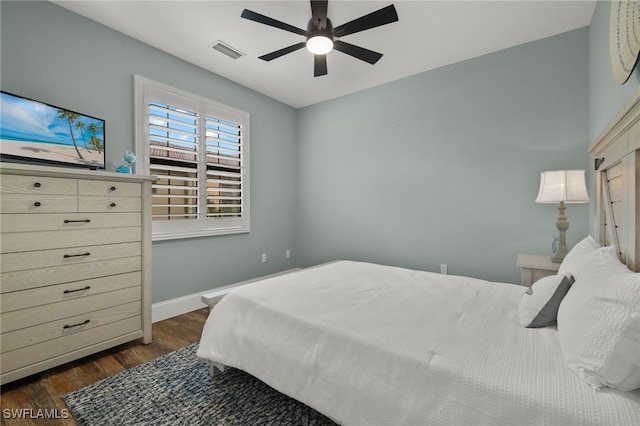 bedroom featuring ceiling fan and dark hardwood / wood-style flooring