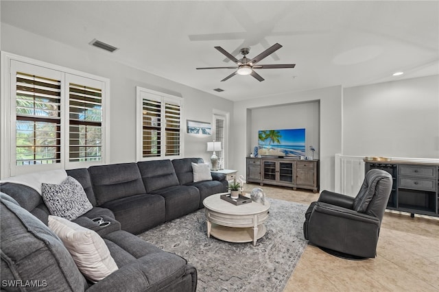 living room featuring ceiling fan and light tile patterned floors