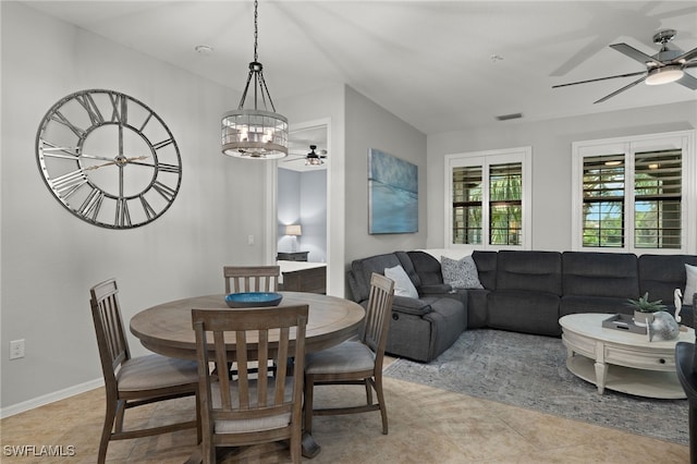 dining room featuring light tile patterned flooring and a chandelier