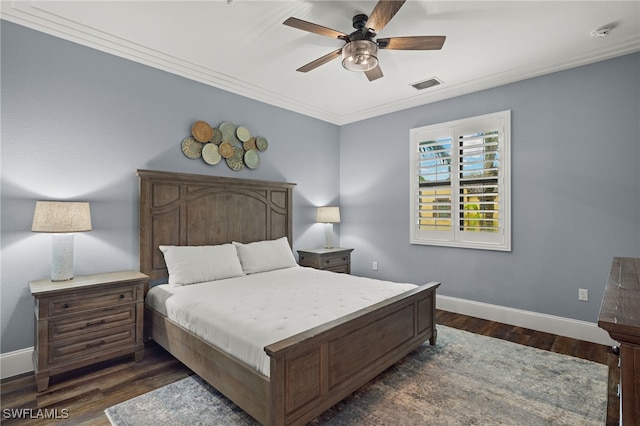 bedroom with dark hardwood / wood-style floors, ceiling fan, and crown molding