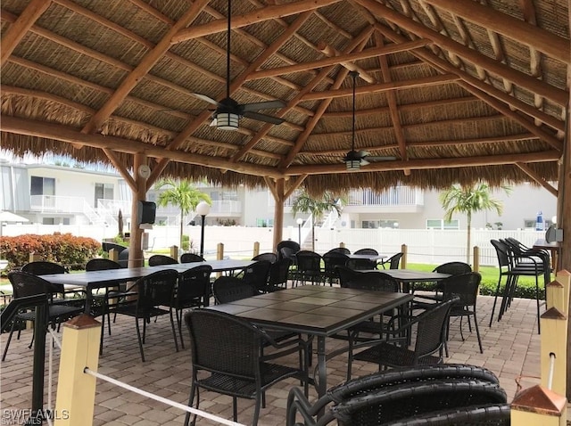 view of patio featuring ceiling fan and a gazebo