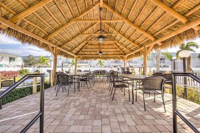 view of patio featuring ceiling fan and a gazebo