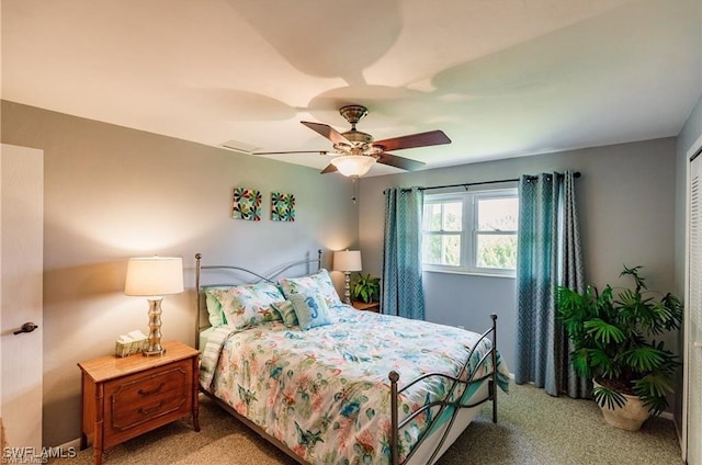 carpeted bedroom with ceiling fan