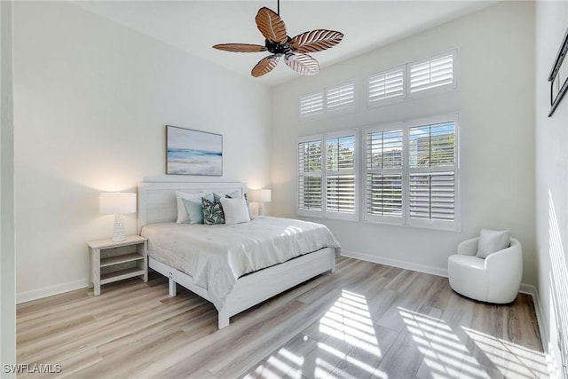 bedroom featuring ceiling fan and light hardwood / wood-style floors