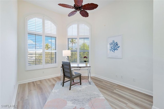 office space featuring light wood-type flooring and ceiling fan