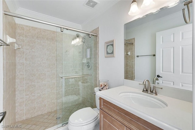 bathroom with crown molding, vanity, toilet, and a shower with shower door