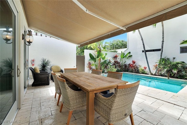 view of patio / terrace featuring a fenced in pool