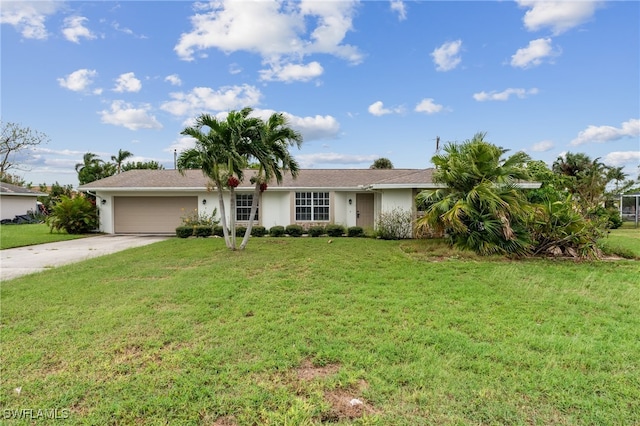 ranch-style home with a garage and a front yard