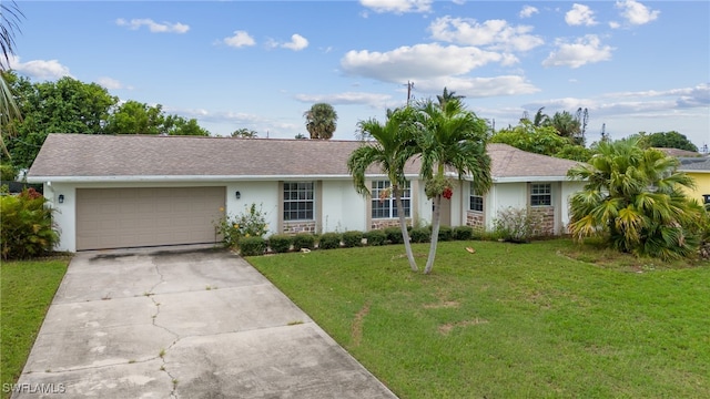 ranch-style home with a garage and a front lawn