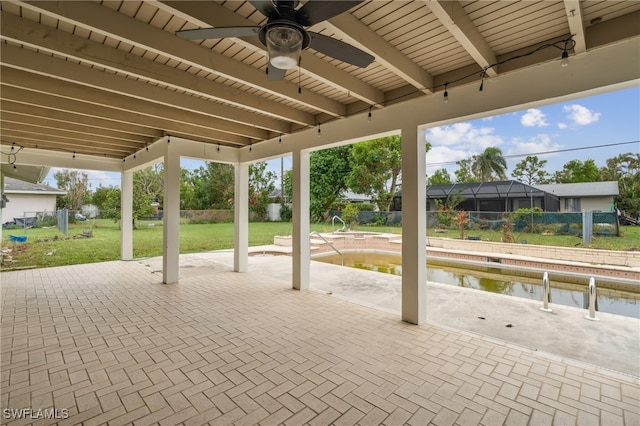 view of patio / terrace with ceiling fan and a lanai