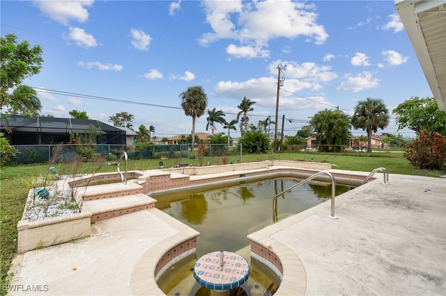 view of pool with a patio and a yard