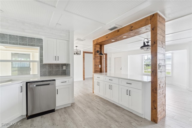 kitchen featuring white cabinetry, stainless steel dishwasher, decorative backsplash, and light hardwood / wood-style floors