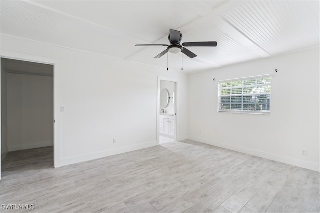 spare room featuring ceiling fan and light wood-type flooring