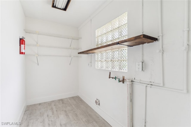 laundry area featuring light hardwood / wood-style flooring