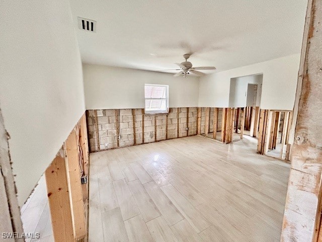 unfurnished room with ceiling fan and light hardwood / wood-style flooring