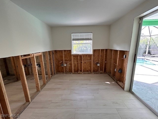 empty room featuring wooden walls