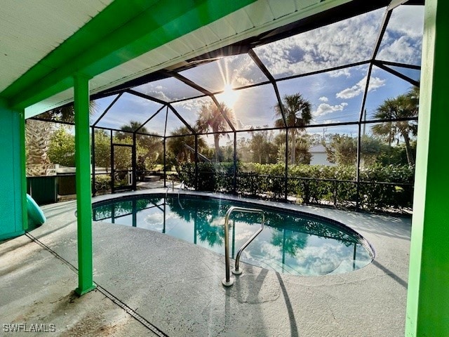 view of pool featuring a lanai and a patio area