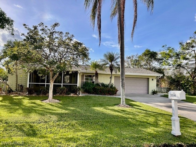 ranch-style house featuring a garage and a front lawn