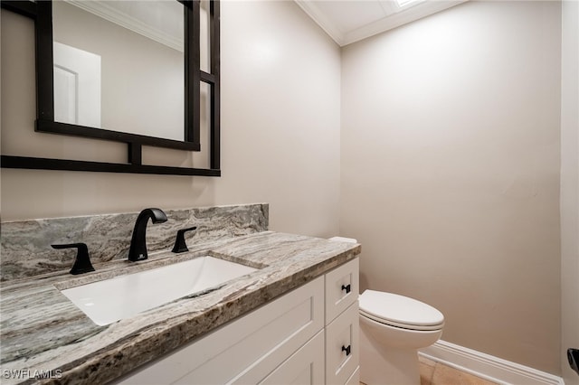 bathroom featuring tile patterned flooring, vanity, toilet, and crown molding