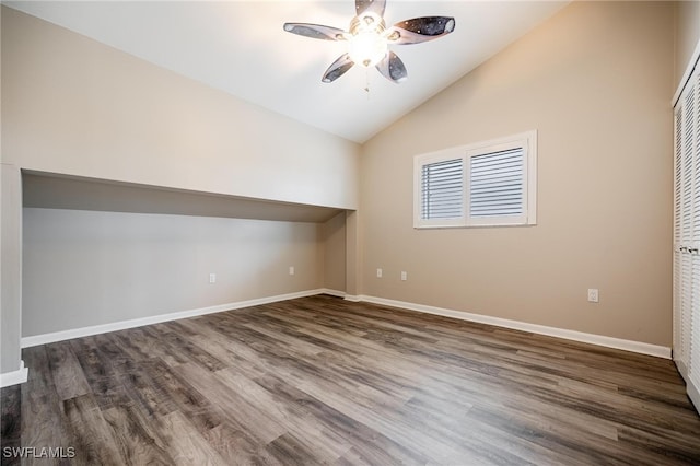 unfurnished room featuring ceiling fan, dark hardwood / wood-style floors, and high vaulted ceiling