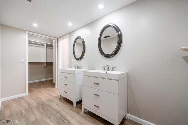 bathroom featuring hardwood / wood-style floors and vanity