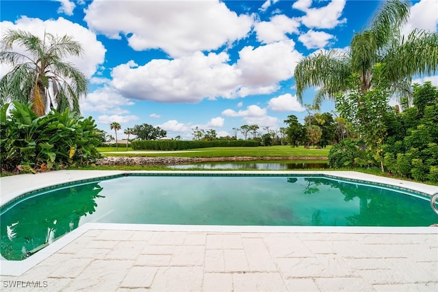 view of pool with a water view