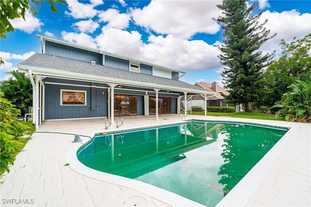 view of swimming pool with a patio