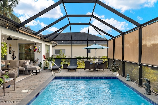 view of pool with a patio, a lanai, and an outdoor hangout area