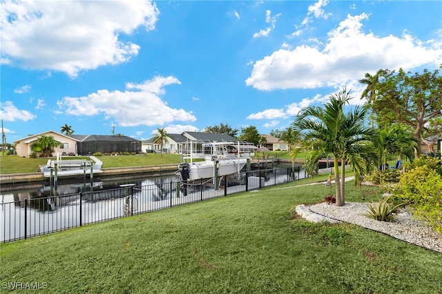 surrounding community featuring a water view and a lawn