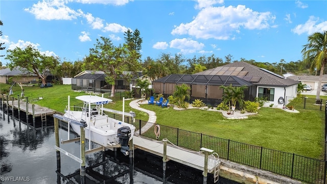 view of dock with a lawn, a lanai, and a water view