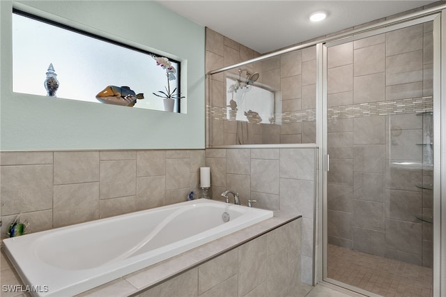 bathroom featuring plus walk in shower