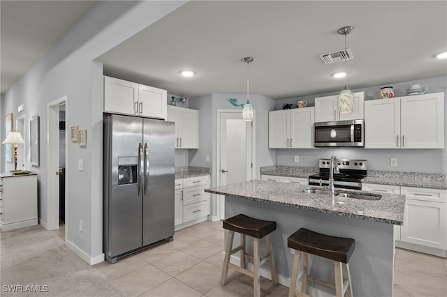 kitchen featuring white cabinetry, sink, and stainless steel appliances