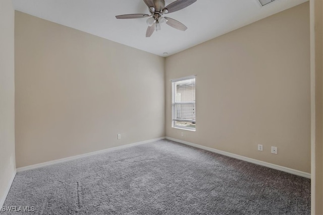 carpeted empty room with ceiling fan