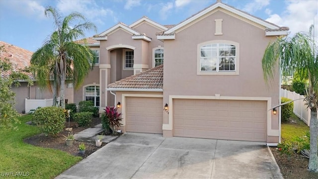 2798 Via Piazza Loop, Fort Myers, FL 33905 - mediterranean / spanish-style house with stucco siding, a tiled roof, driveway, and an attached garage