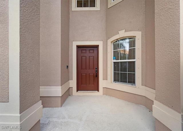 2798 Via Piazza Loop, Fort Myers, FL 33905 - doorway to property featuring stucco siding