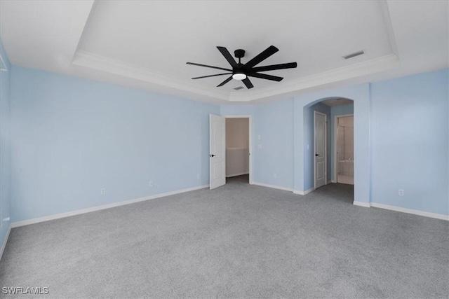 2798 Via Piazza Loop, Fort Myers, FL 33905 - carpeted spare room with a raised ceiling, arched walkways, a ceiling fan, crown molding, and baseboards