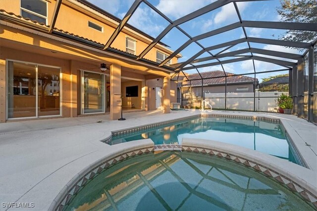 2798 Via Piazza Loop, Fort Myers, FL 33905 - view of swimming pool with a pool with connected hot tub, a patio area, and glass enclosure