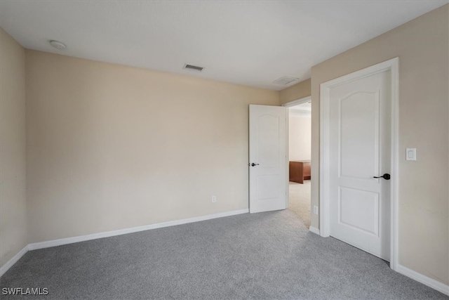 spare room featuring carpet flooring