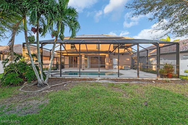 2798 Via Piazza Loop, Fort Myers, FL 33905 - back of property featuring a patio, an outdoor pool, a lawn, and a lanai
