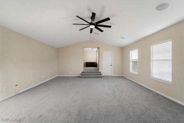 unfurnished living room featuring lofted ceiling, carpet, and ceiling fan