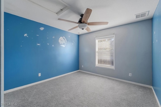 carpeted empty room featuring ceiling fan