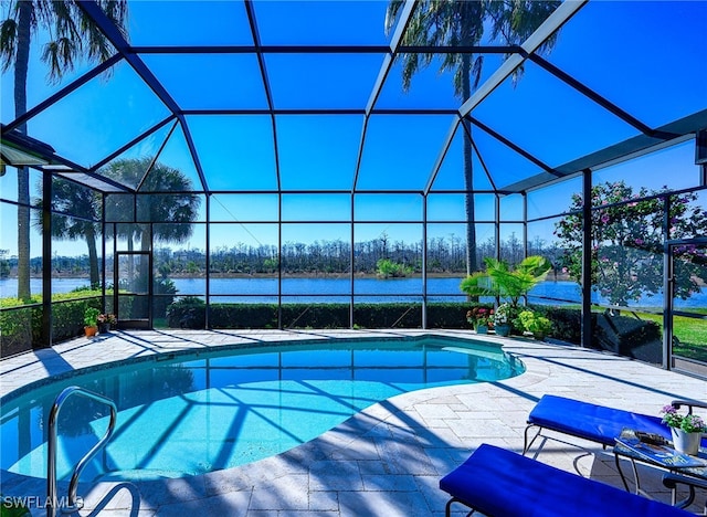 view of pool featuring a water view, glass enclosure, and a patio area