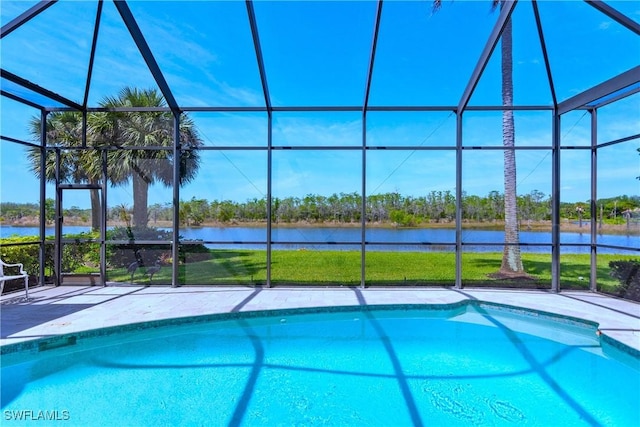 outdoor pool featuring a lanai, a water view, and a patio