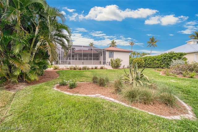 view of yard featuring glass enclosure