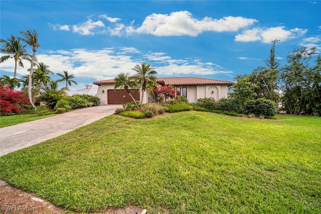 mediterranean / spanish-style house with a garage and a front yard