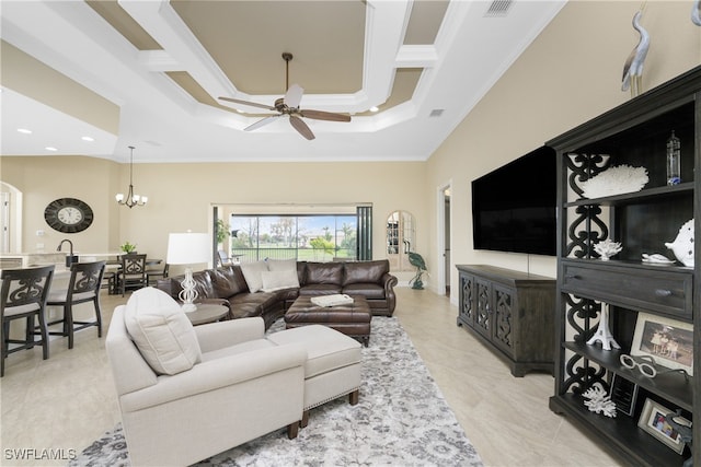 living room with ceiling fan with notable chandelier and crown molding