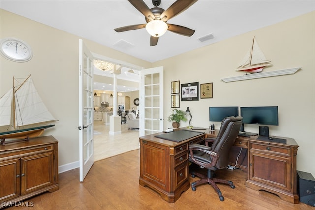 home office featuring light wood-type flooring, french doors, and ceiling fan