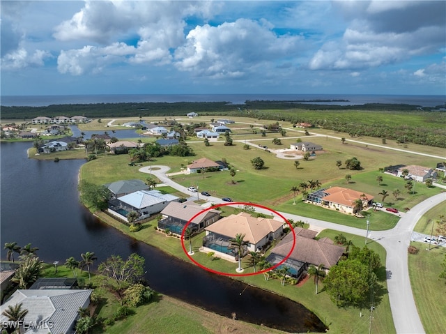 birds eye view of property featuring a water view